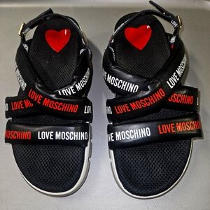 Moschino logo sandals.  Great condition